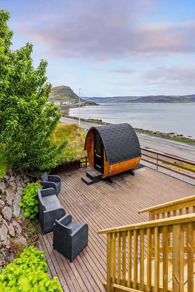 The barrel sauna on the deck at Hotel West, looking out over the fjord